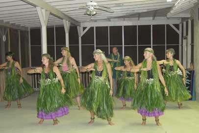 Hula Intensive students dancing in ti leaf skirts they made